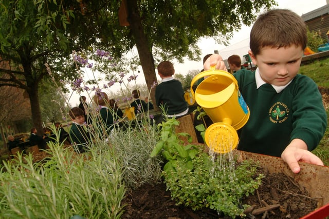 Six-year-old Jack Tomlinson waters the eco-garden at St Lukes Primary School in Shireoaks.