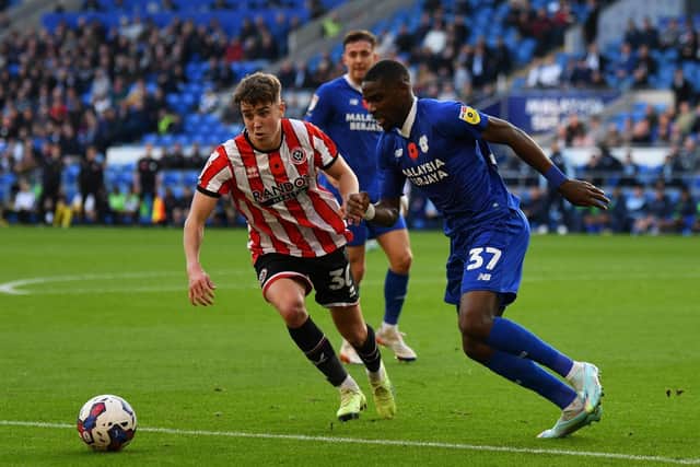 Sheffield United's Oliver Arblaster (left) and Cardiff City's Niels Nkounkou during the Sky Bet Championship match in November: Simon Galloway/PA Wire.