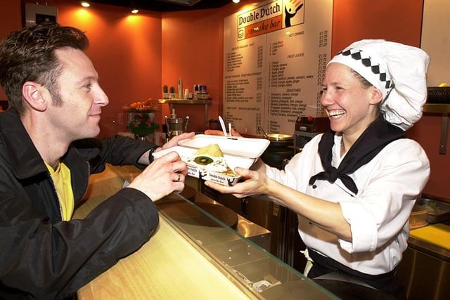 Martine Verweij serves a customer at the Double Dutch Pancake House, Orchard Square, January 7, 2001