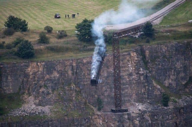 Peak District photographer Villager Jim previously shared this photo of the Mission: Impossible 7 film shoot of the train going over the edge of the former Darlton Quarry.