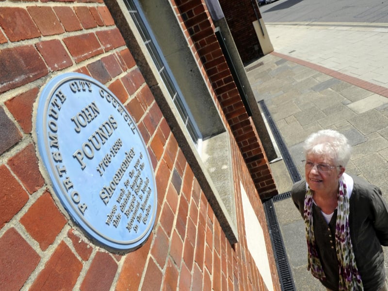 A plaque to celebrate the shoemaker John Pounds has been installed in the High Street, Old Portsmouth to celebrate the man who inspired the creation of charitable schools dedicated to the free education of destitute children in 19th century Britain.
Pictured: Daughter of the Reverend John Sturges, Barbara McLeod at the John Pounds plaque in Old Portsmouth.