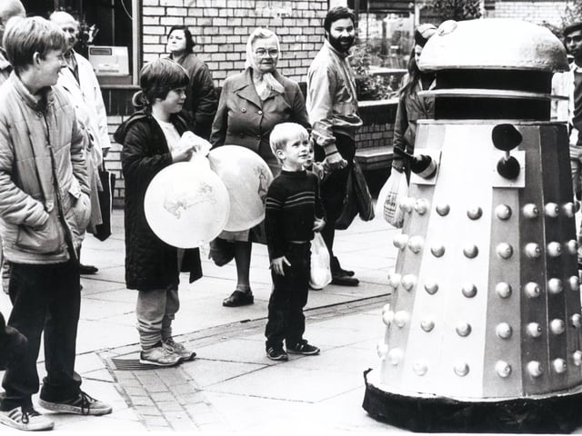A little boy is amazed to find a Dalek on The Moor, Sheffield, in October 1985