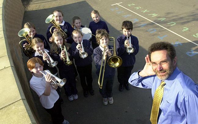 Mosborough Primary school head Gordon Hamilton with the school's brass band, February 18, 2003