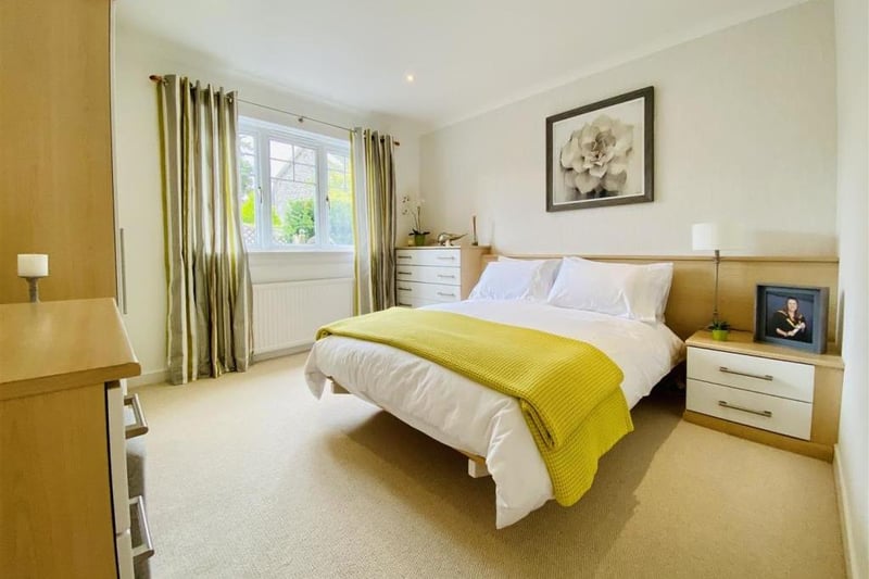 Another large bedroom which cleverly uses accent colours to give the room its own distinct character.