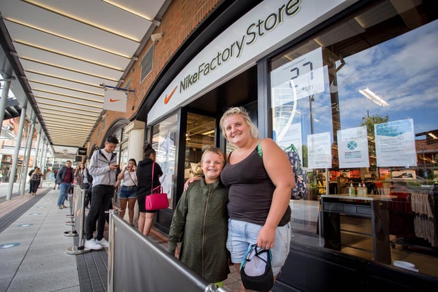 Claire Harper and her son, Harley 7 outside Nike store in Gunwharf Quays as it reopened.