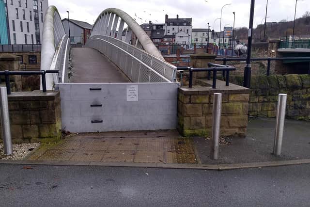 The Holiday Inn Express has erected a barrier across a footbridge over the River Don at Castlegate (copyright Mark Baker)