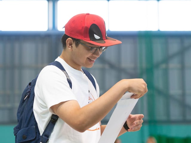 Justin Dizon opens his results at UTC College in Portsmouth. Picture: Habibur Rahman