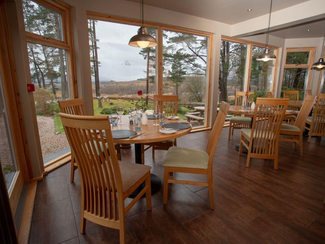 Old Pines Restaurant and Hotel is a modern wood and stone building in a rural area near Fort William, Ben Nevis, and Loch Ness in the highlands of Scotland.
