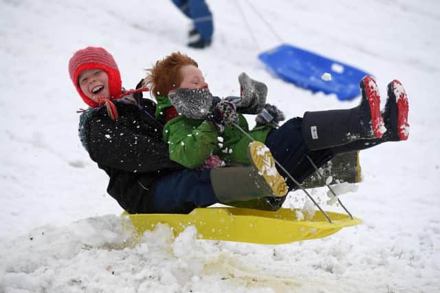 Children enjoy a day off school with some sledging (Photo by Finnbarr Webster/Getty Images)