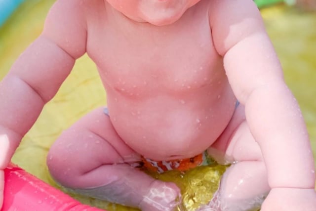 Thea Benson aged seven months enjoying a paddling pool from @lifewithbensons