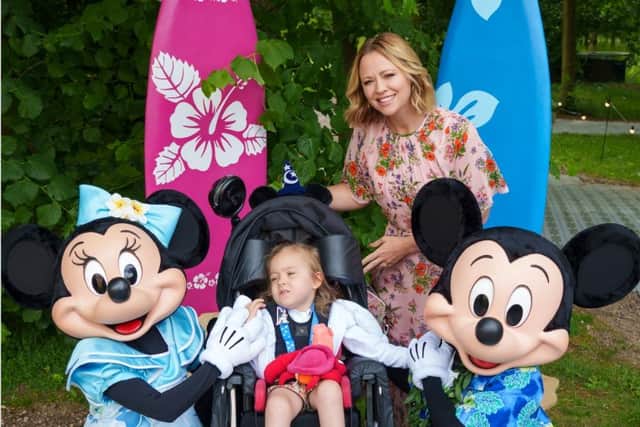 Sheffield youngster Lillia Sheppard was too ill to go to Disneyland - so Disney brought it to her. LIllia is pictured at the Hoar Cross Hall Spa Hotel, with some of the Disney characters Picture: Rich Hanson/Still Moving for Disney