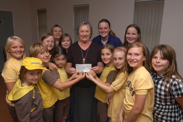 In 2009 Audrey Wardman, centre, who is the past president of the Inner wheel club of Bolsover, presents a £300 cheque to brownies from the 1st Pleasley and New Houghton group.  The money comes from various fund raising activities throughout Mrs Wardman's term of office and will be put towards a camp holiday.