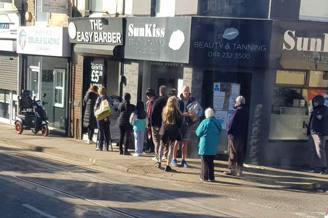 Long queue outside a barber in Hillsborough this morning. Picture by Jamie Shaw