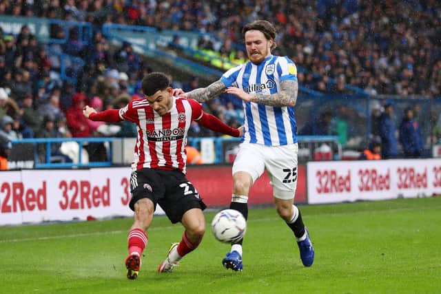 Morgan Gibbs-White of Sheffield United crosses the ball under pressure from Danny Ward of Huddersfield Town: George Wood/Getty Images