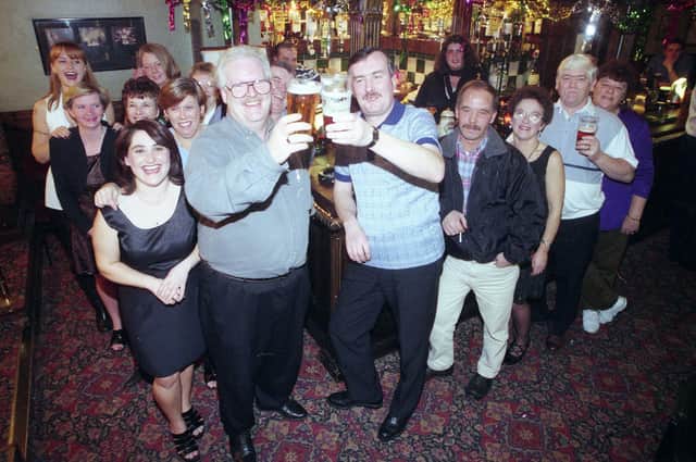 Regulars and staff at Castletown Workmen's Club in 1977, but who can remind us of their reasons for celebrations?