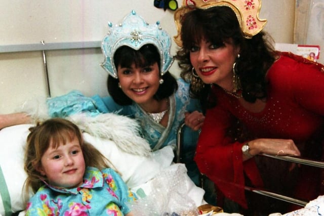 Members of the cast of the Sheffield Lyceum pantomime Aladdin visit patients at Sheffield Children's Hospital, January 14, 1993. Vicki Michelle from TV comedy  'Allo 'Allo is pictured right