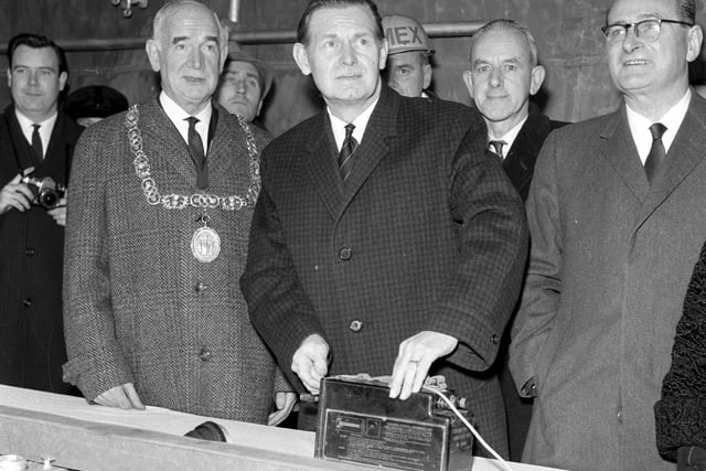 Secretary of State for Scotland Willie Ross presses the button to begin the demolition part of Glasgow's urban motorway scheme in December 1965.