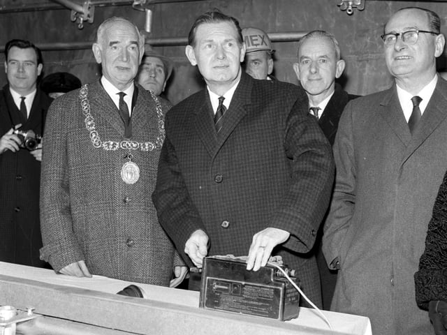 Secretary of State for Scotland Willie Ross presses the button to begin the demolition part of Glasgow's urban motorway scheme in December 1965.