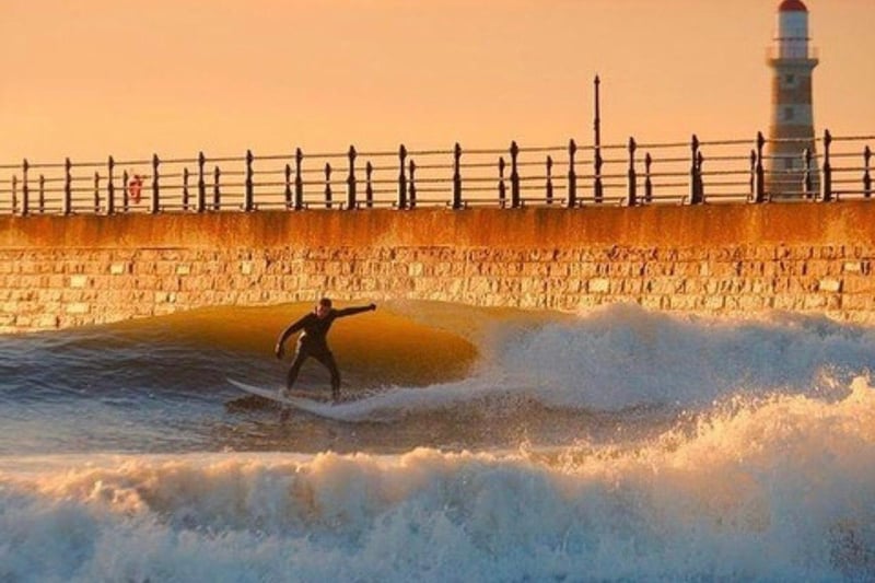 Living in a city by the sea means many could take a breather from the stresses of the pandemic by surfing, paddle boarding, swimming and more. This surfer was captured last summer by John Alderson.