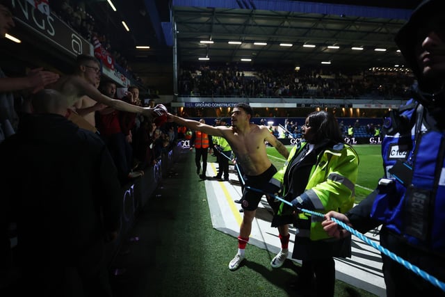 Morgan Gibbs-White gives his shirt to a Sheffield United fan after victory at Queens Park Rangers (Ryan Pierse/Getty Images)