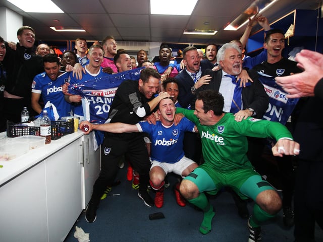 Players and staff toast the triumph.