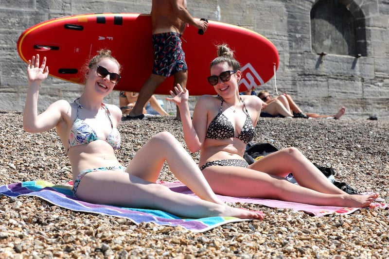 Carys Reed, 23, and Lucy Barron, 23, enjoy the sun trap at the Hot Walls.