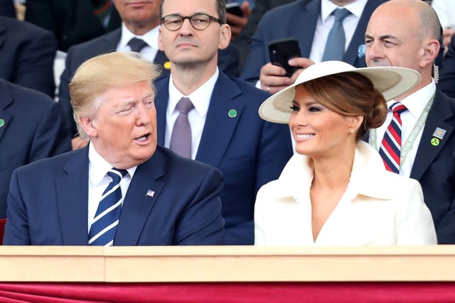 US President Donald Trump talks with US First Lady Melania Trump in the royal box. Picture: CHRIS JACKSON/AFP/Getty Images