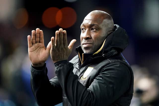 Sheffield Wednesday manager Darren Moore claps along to Hi Ho Silver Lining ahead of their win over Wigan Athletic.