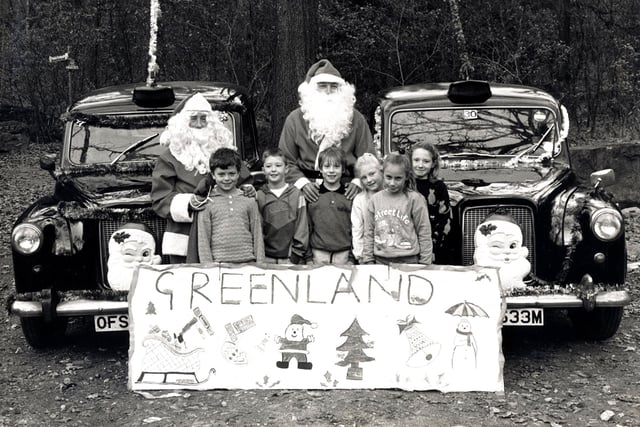Taxi drivers dressed as Father Christmas to raise funds for Sheffield Children's Hospital, seen here with children from Meynell School....Colin Beard and Lawrence Churchill are the drivers, December 1989