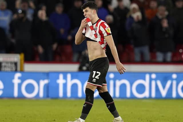 John Egan was sent-off during Sheffield United's win over Coventry City and will miss the trip to Blackpool: Andrew Yates / Sportimage