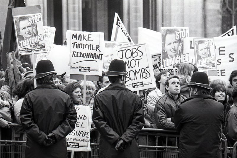 Protestors gather outside Sheffield Cathedral as Margaret Thatcher visits the Cutlers Hall on April 28, 1983