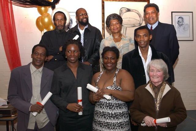 Community members are pictured with awards  presented at an event organised by Sheffield Futures to mark Black History Month in 2003
