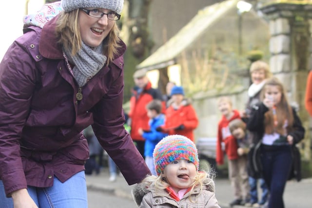 Two year old Isla Worrall took part in the Winster Pancake Race in 2015