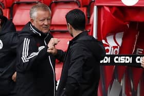 Sheffield United manager Chris Wilder (centre left) and Arsenal manager Mikel Arteta fist bump: Andrew Boyers/NMC Pool/PA Wire.