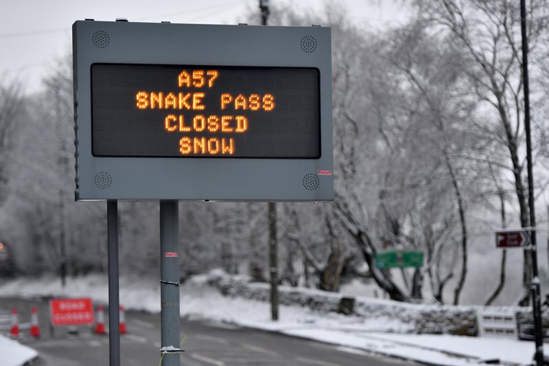 A sign showing the A57 Snake Pass closed after snowfall overnight in Glossop in the High Peak on January 30, 2019