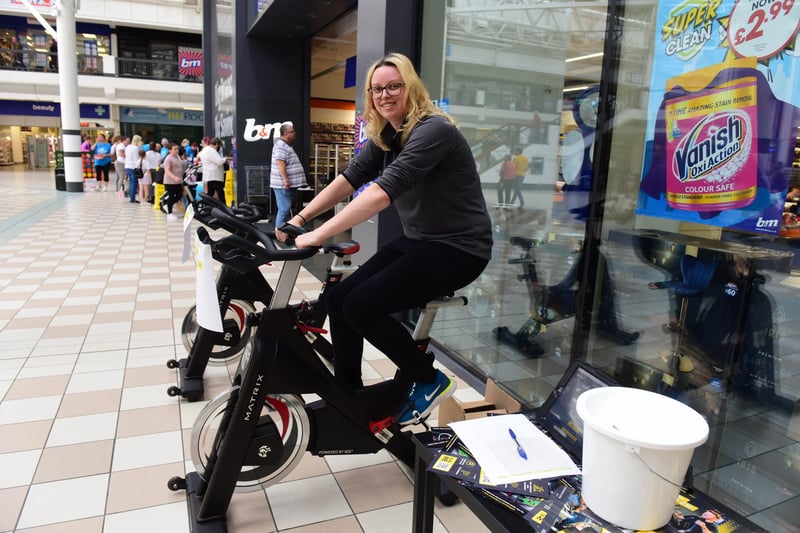Kendall Tipp, of Xercise4less, cycles to raise more money.