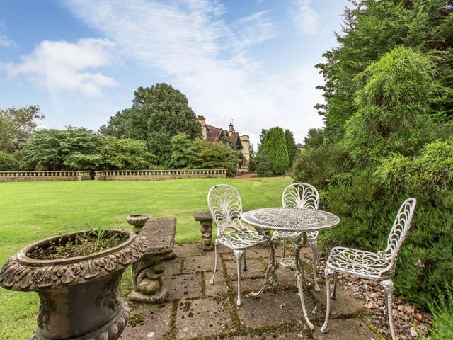 The garden comes with a partly walled croquet lawn, patio seating and a garden summerhouse.