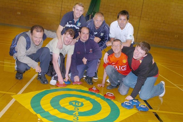 Trying out curling at the Mill House Centre in 2009.