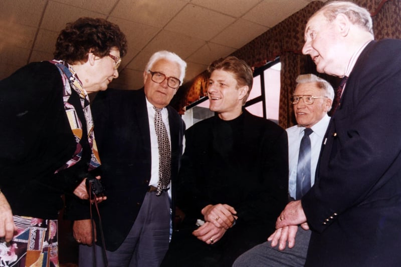 Sean Bean chats with guests including ex-referee George McCabe, Roy Ashton, Ken Tomlinson and Frank T Yates before his lunch as guest of the Senior Blades in the Sheffield United Executive Suite in March 1996