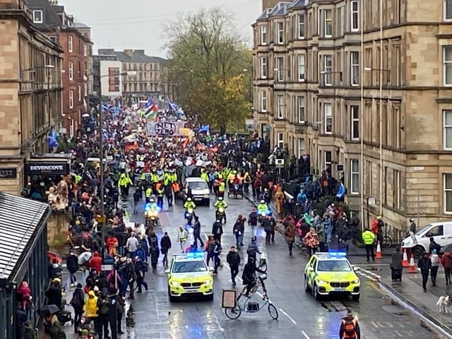 Police officers were trying to maintain control as crowds march through Glasgow streets.