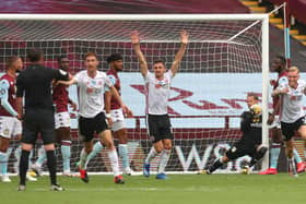Sheffield United players 'celebrate' what should have been the opening goal in the game at Aston Villa in the first Premier League fixture after the three-month lockdown brought on by the coronavirus crisis. (Photo by Carl Recine/Pool via Getty Images)