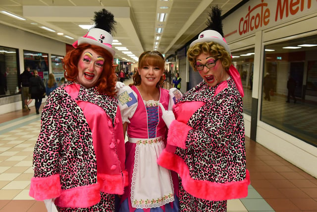 Cinderella Hannah Woodward with the Ugly Sisters at Santa's arrival parade at Middleton Grange Shopping Centre, on Sunday.