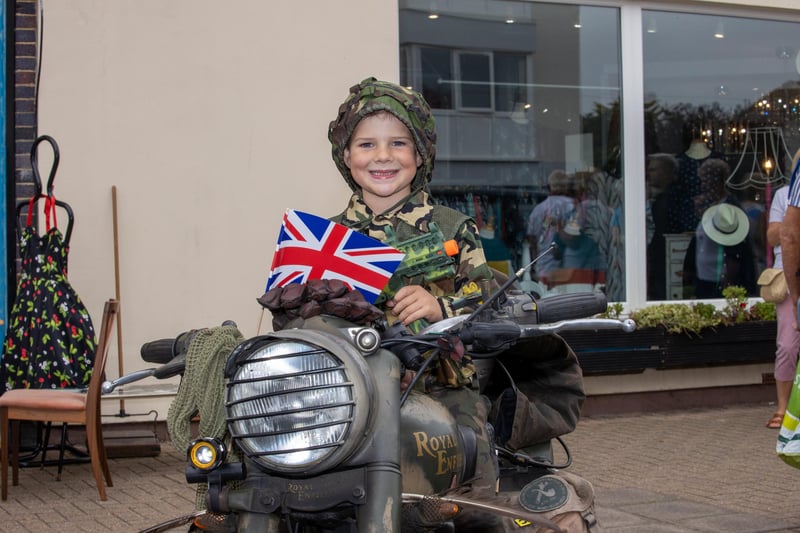 Teddy Wootton, 5 is a keen military enthusiast and enjoyed posing on a vintage military bike during the Lee Victory Parade in Lee-on-Solent on the 25th September 2021. Photo By Alex Shute