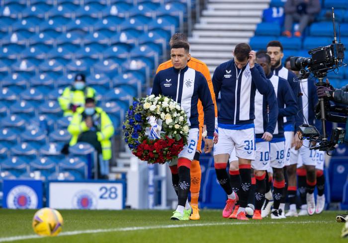 Rangers' James Tavernier carries a wreath as he leads the home team out on the 50th anniversary of the Ibrox Disaster  (Photo by Alan Harvey / SNS Group)