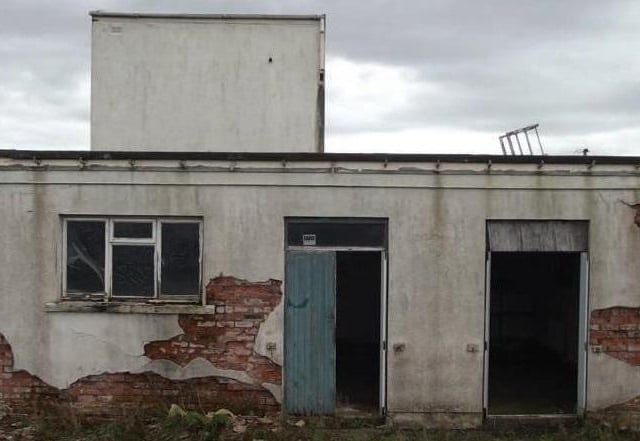 The decay is evident on the side of the building