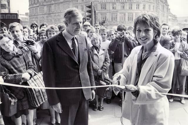 Michael Frampton looks on as actress Jan Francis cuts the ribbon at H.L. Brown's new shop in Barker's Pool, Sheffield, in 1986