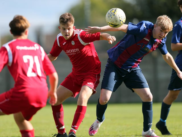 McKenzie Morgan, second left, battles for possession against US Portsmouth. Picture: Chris Moorhouse