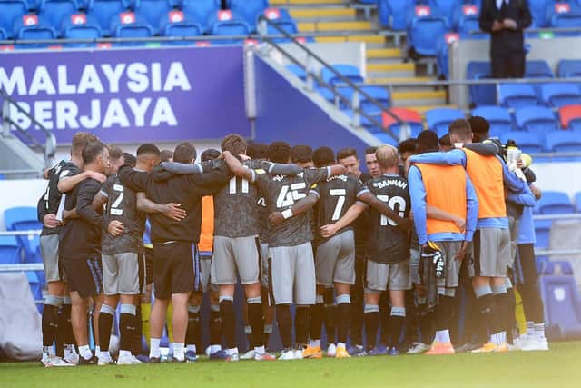 Sheffield Wednesday embrace in a group huddle after a opening day victory.