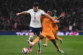 England's defender Harry Maguire (L) vies with Ivory Coast's striker Maxwel Cornet (R) during the international friendly football match between England and Ivory Coast at Wembley  (Photo by GLYN KIRK/AFP via Getty Images)