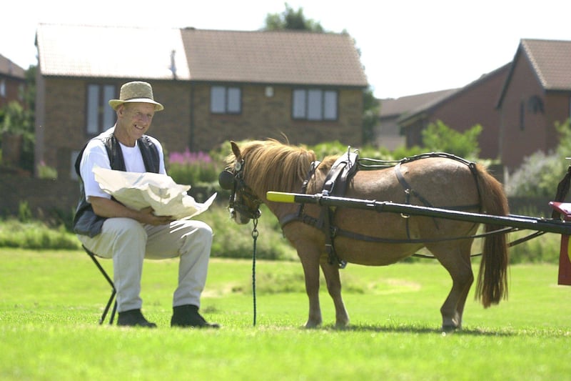 Michael Kirby from Beighton, Sheffield takes it easy with fish and chips and pony Chelsea at Beighton Gala in July 2003